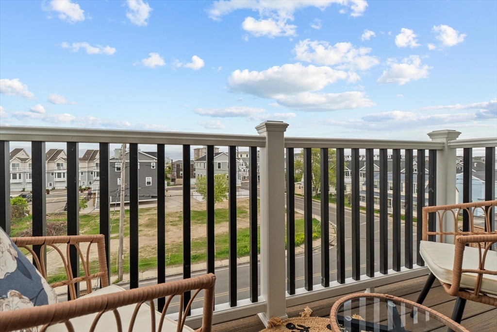 30 Cable Avenue, Unit 3 Salisbury, MA 01952 - Photo 26 of 31 a balcony with table and chairs