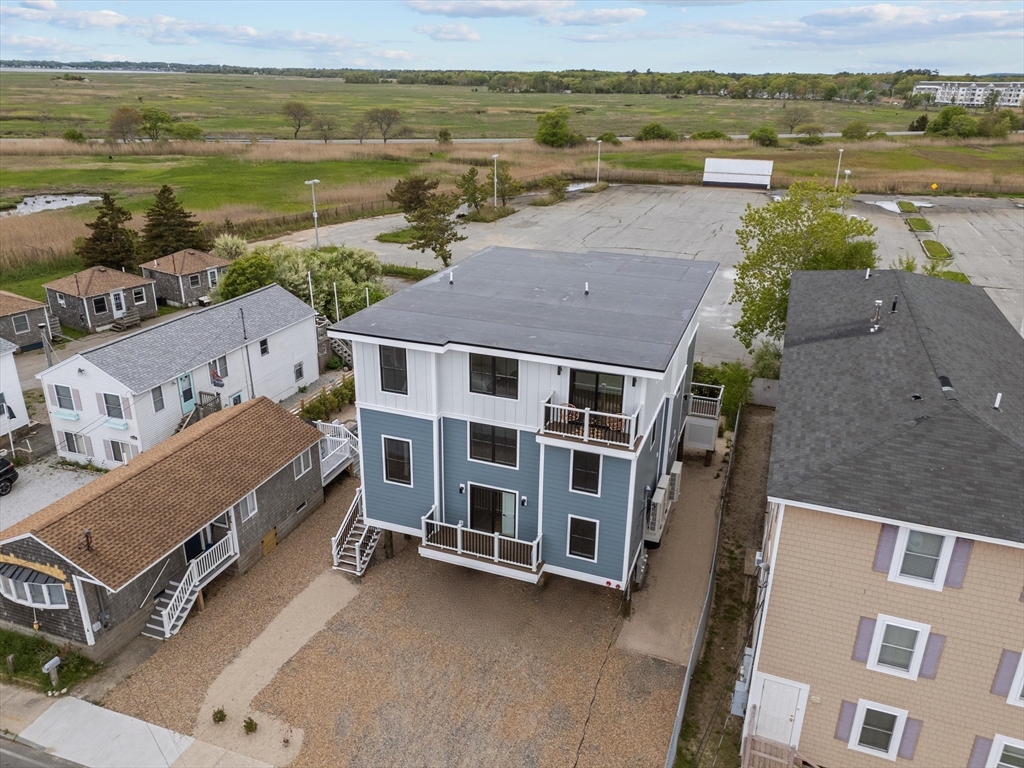 30 Cable Avenue, Unit 3 Salisbury, MA 01952 - Photo 28 of 31 a view of a city with lawn chairs