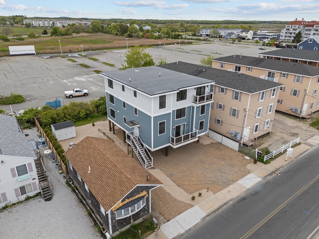 30 Cable Avenue, Unit 3 Salisbury, MA 01952 - Photo 29 of 31 an aerial view of a house with a yard and lake view