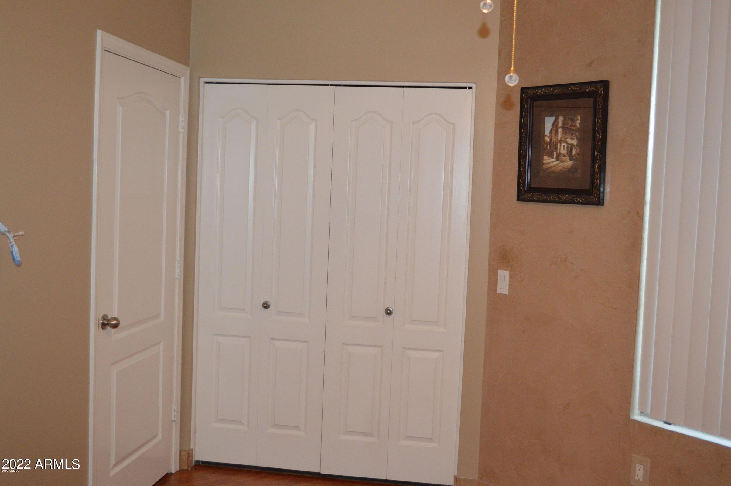 1701 East Colter Street, Unit 112 Phoenix, AZ 85016 - Photo 13 of 47 a view of a hallway with wooden floor