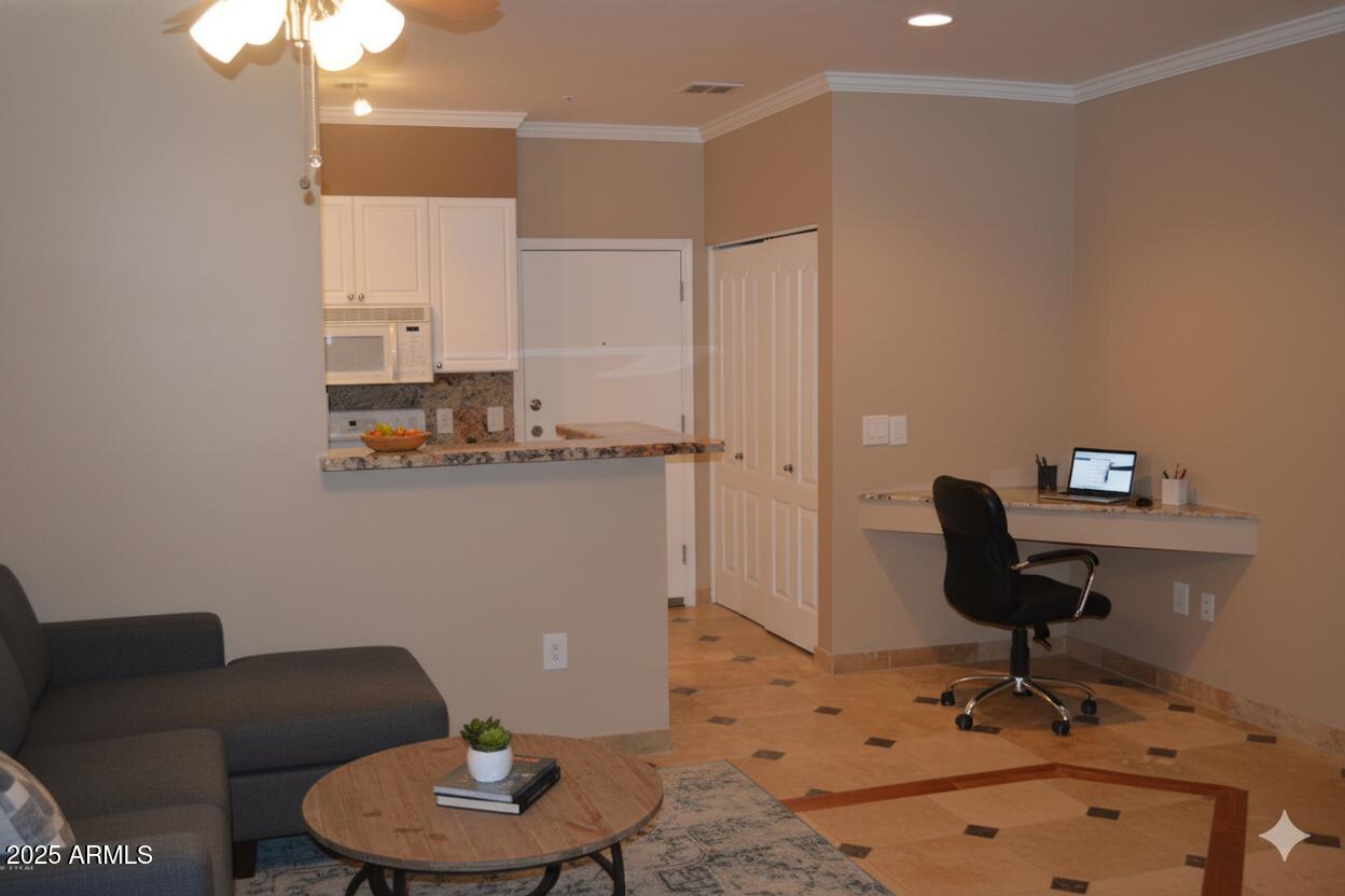 1701 East Colter Street, Unit 112 Phoenix, AZ 85016 - Photo 2 of 47 a living room with furniture and a mirror