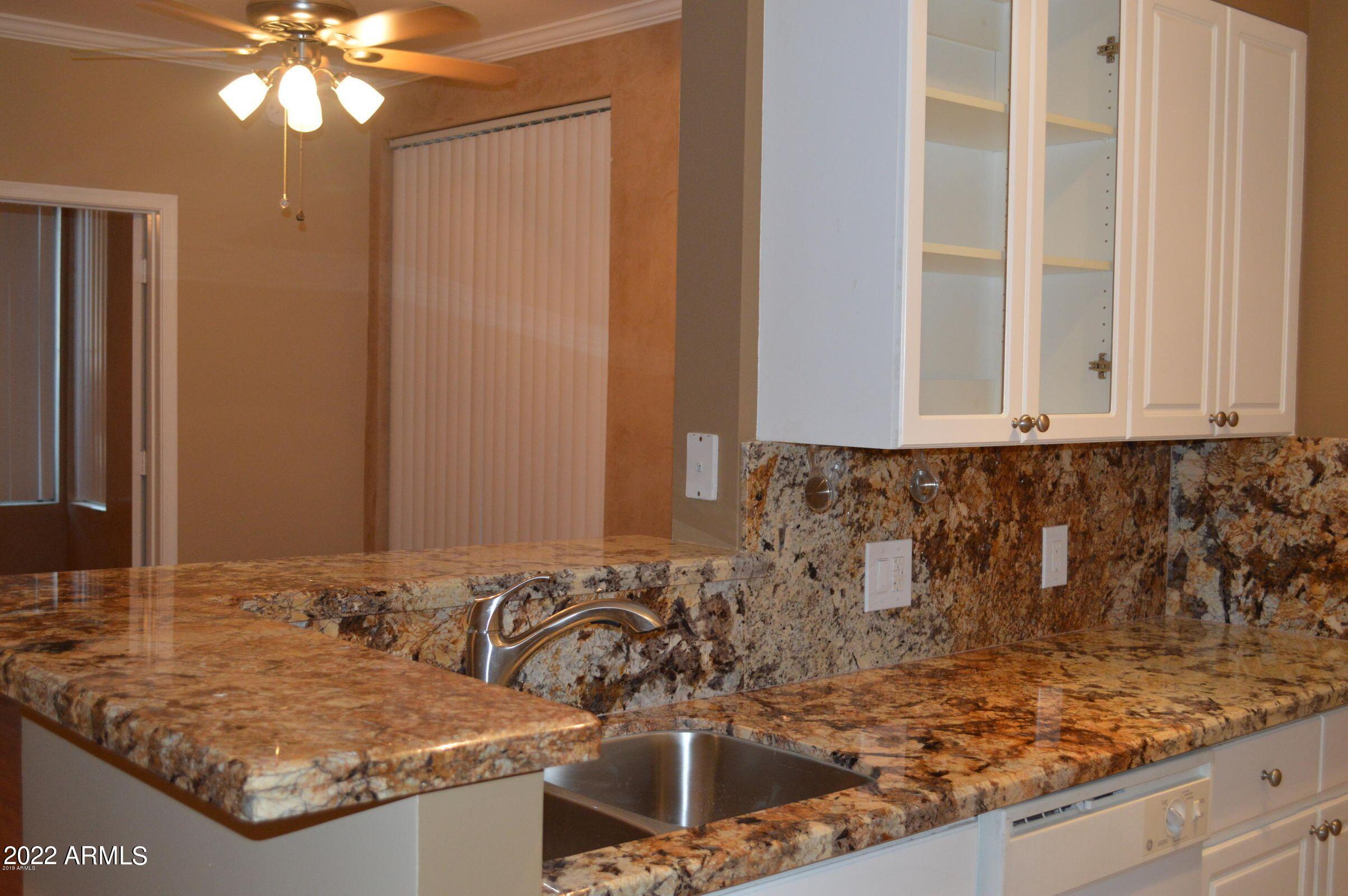 1701 East Colter Street, Unit 112 Phoenix, AZ 85016 - Photo 5 of 47 a bathroom with a granite countertop sink and a mirror
