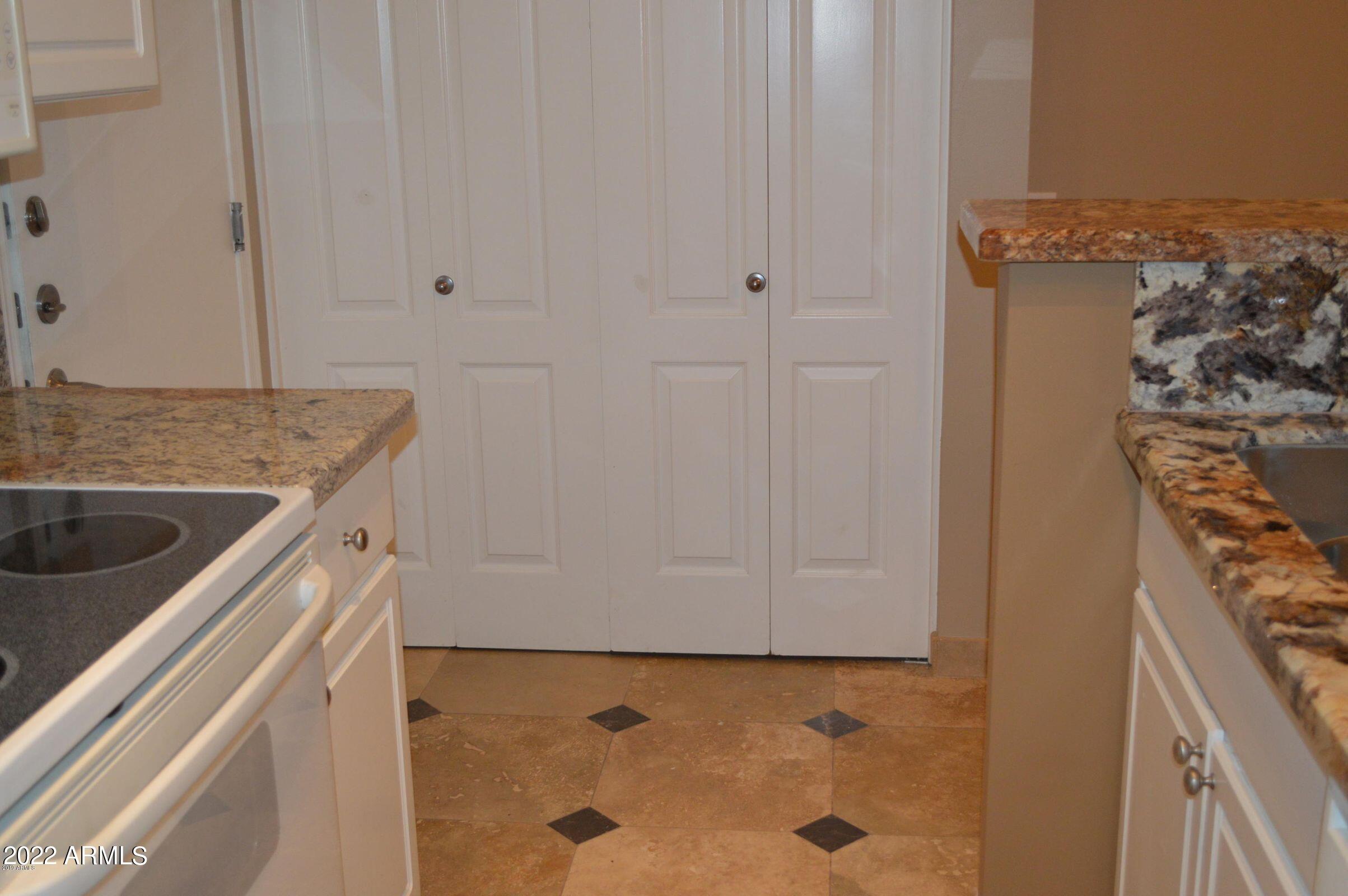 1701 East Colter Street, Unit 112 Phoenix, AZ 85016 - Photo 7 of 47 a view of a kitchen cabinets