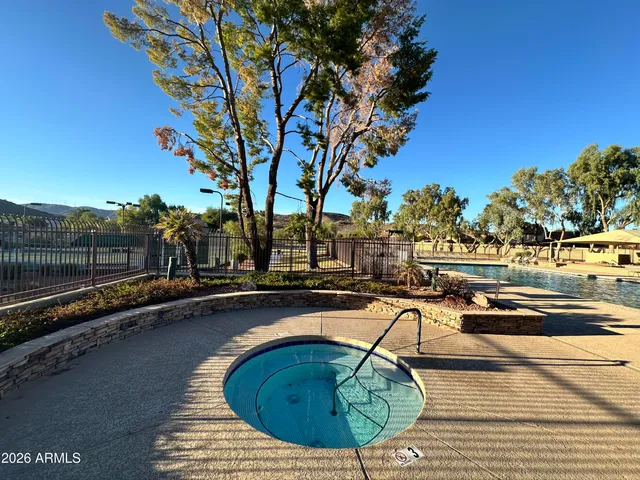 a view of a swimming pool with a lounge chair