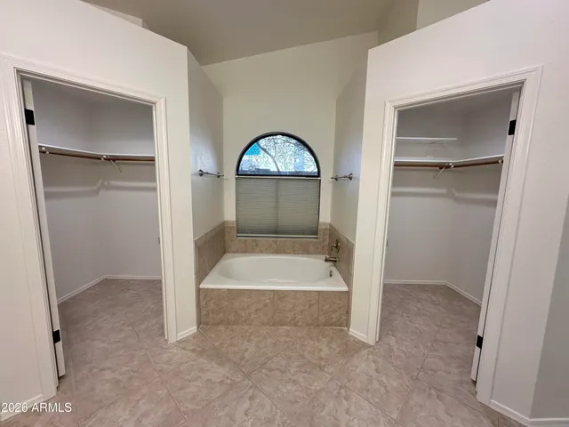 a bathroom with a tub and shower