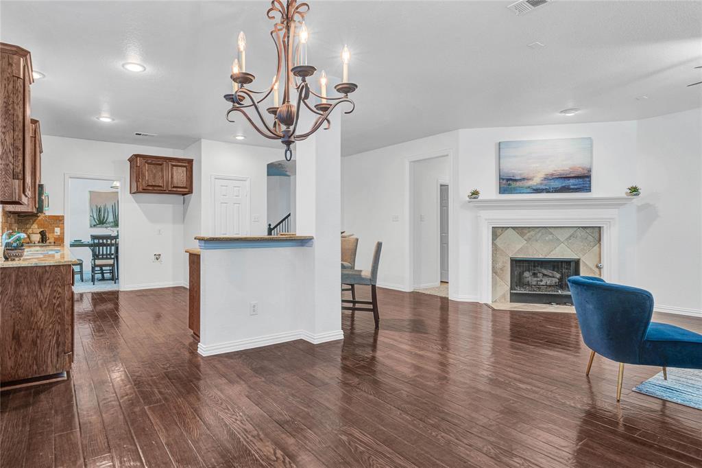 1504 Tangle Ridge Drive McKinney, TX 75071 - Photo 12 of 36 a view of a livingroom with furniture and a fireplace