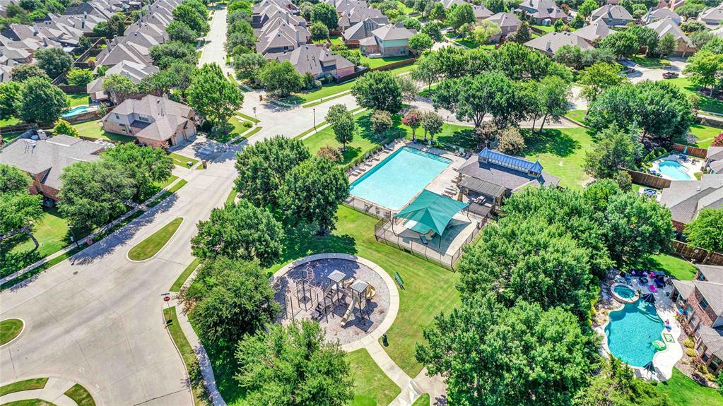 1504 Tangle Ridge Drive McKinney, TX 75071 - Photo 22 of 36 an aerial view of a house a garden and swimming pool