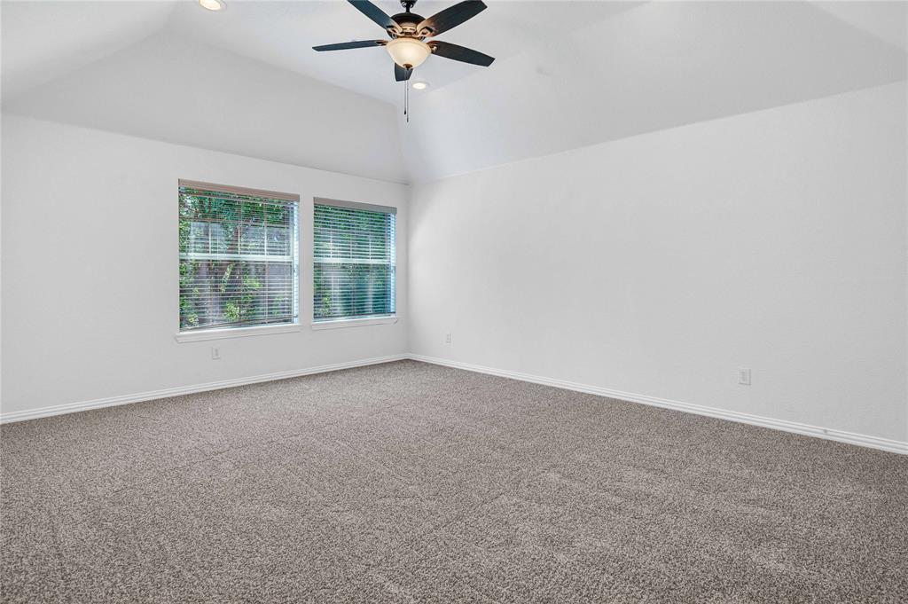 1504 Tangle Ridge Drive McKinney, TX 75071 - Photo 25 of 36 an empty room with a window and a fan