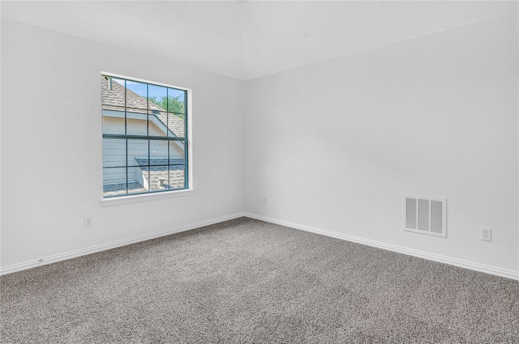 1504 Tangle Ridge Drive McKinney, TX 75071 - Photo 27 of 36 an empty room with windows