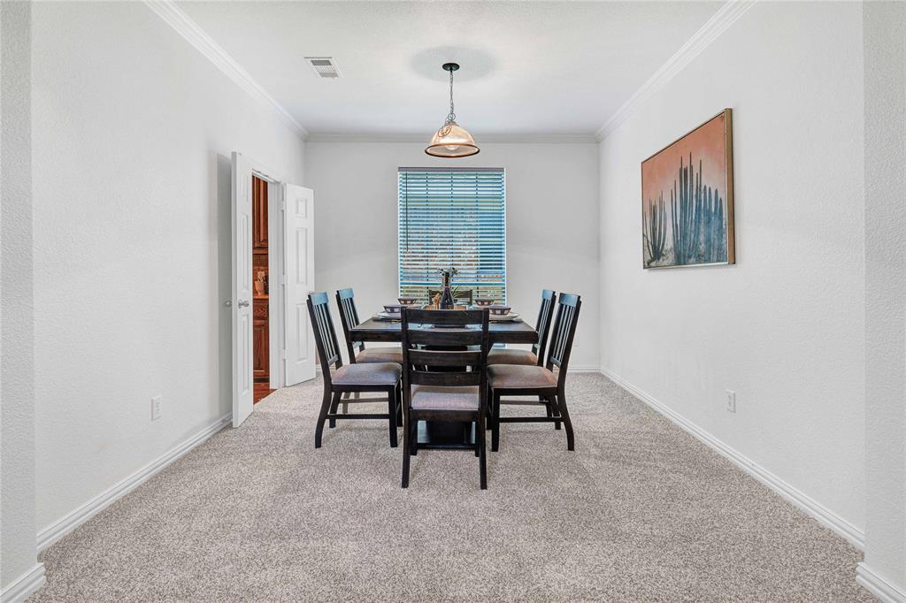 1504 Tangle Ridge Drive McKinney, TX 75071 - Photo 4 of 36 a dining room with furniture and window