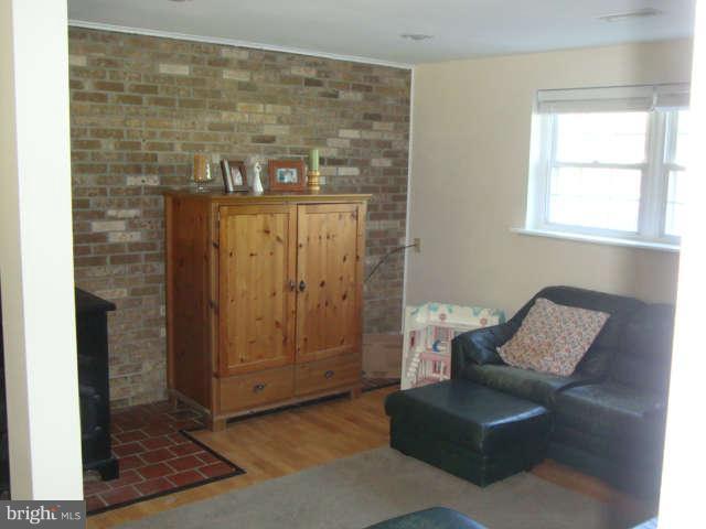 3311 Dublin Manor Road Street, MD 21154 - Photo 22 of 30 LL Family room w/Brick wall