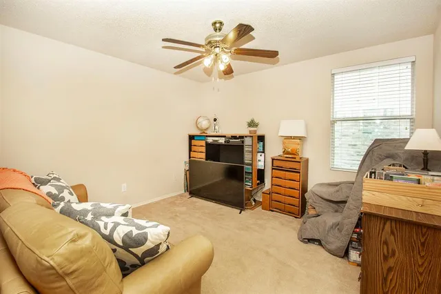 a bedroom with furniture and a chandelier