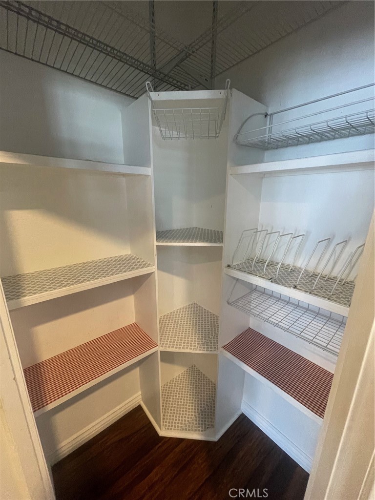 15181 Van Buren Boulevard, Unit 22 Riverside, CA 92504 - Photo 22 of 61 a walk in closet with wooden floor