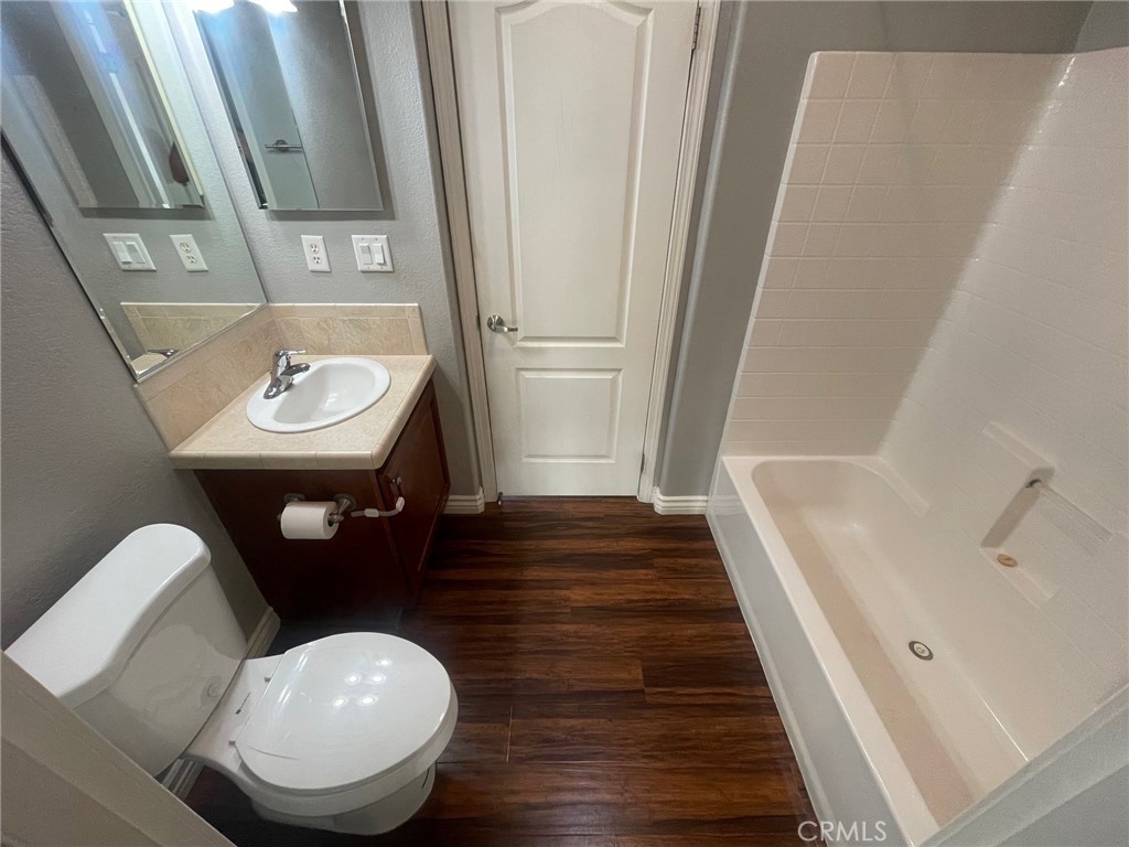 15181 Van Buren Boulevard, Unit 22 Riverside, CA 92504 - Photo 24 of 61 a bathroom with a sink and a mirror