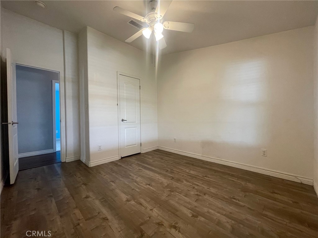 15181 Van Buren Boulevard, Unit 22 Riverside, CA 92504 - Photo 27 of 61 an empty room with closet and a ceiling fan