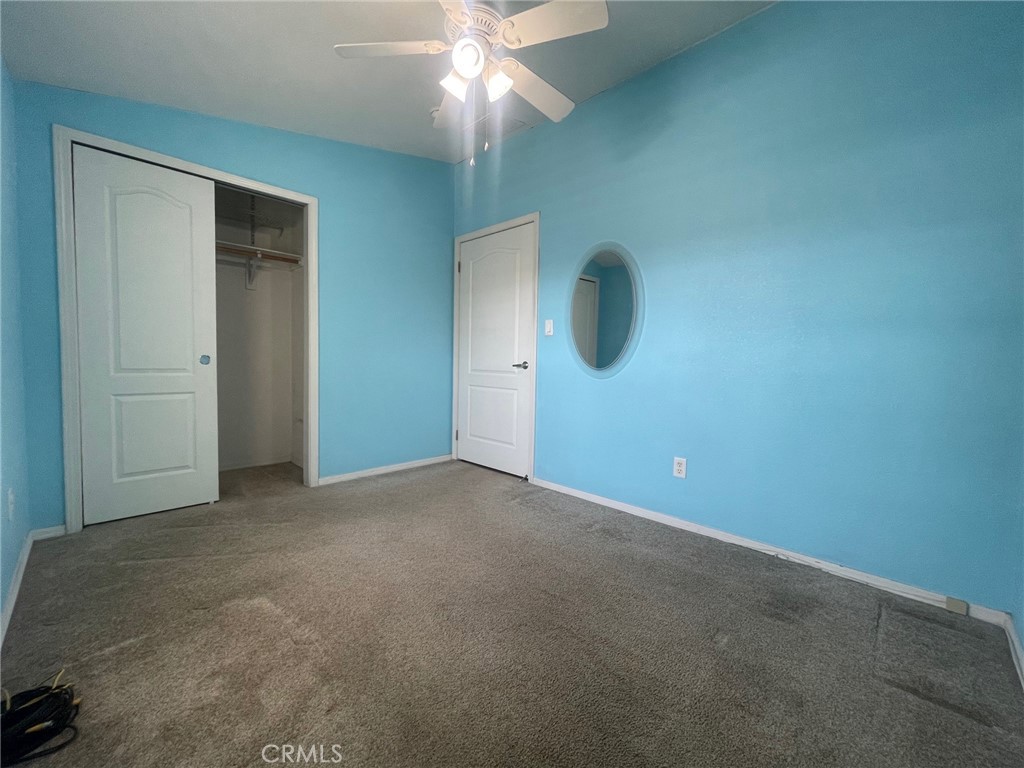 15181 Van Buren Boulevard, Unit 22 Riverside, CA 92504 - Photo 31 of 61 an empty room with fan and fan