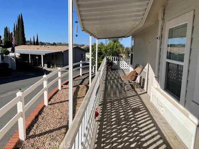15181 Van Buren Boulevard, Unit 22 Riverside, CA 92504 - Photo 48 of 61 a balcony with furniture and a potted plant