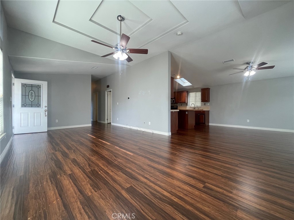 15181 Van Buren Boulevard, Unit 22 Riverside, CA 92504 - Photo 9 of 61 wooden floor in an empty room with a window