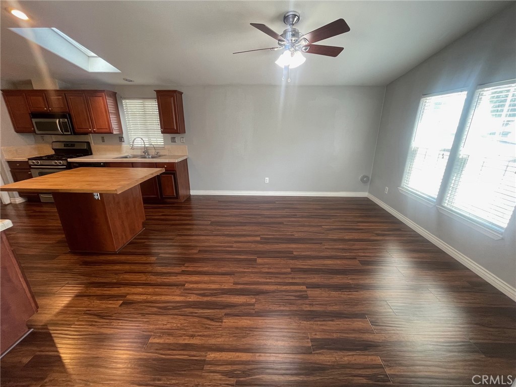15181 Van Buren Boulevard, Unit 22 Riverside, CA 92504 - Photo 10 of 61 a view of kitchen with granite countertop cabinets window and stainless steel appliances