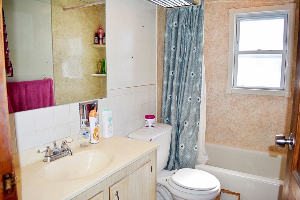 5 Ansara Street Springfield, MA 01104 - Photo 11 of 14 a bathroom with a sink toilet tub and shower