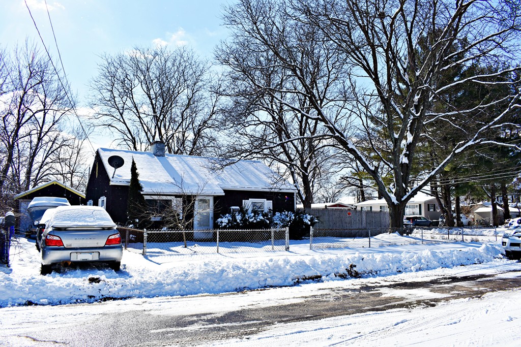 5 Ansara Street Springfield, MA 01104 - Photo 2 of 14 a front view of a house with a yard and trees