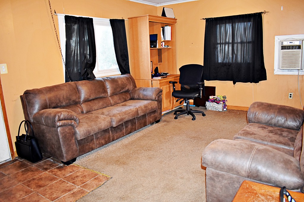 5 Ansara Street Springfield, MA 01104 - Photo 3 of 14 a living room with furniture and a lamp