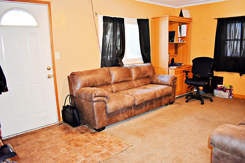 5 Ansara Street Springfield, MA 01104 - Photo 4 of 14 a living room with furniture gym equipment and a large window
