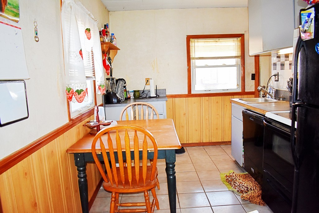 5 Ansara Street Springfield, MA 01104 - Photo 5 of 14 a kitchen with stainless steel appliances a stove a sink and a refrigerator