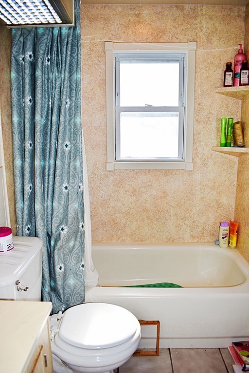 5 Ansara Street Springfield, MA 01104 - Photo 10 of 14 a bathroom with a sink a toilet and bathtub