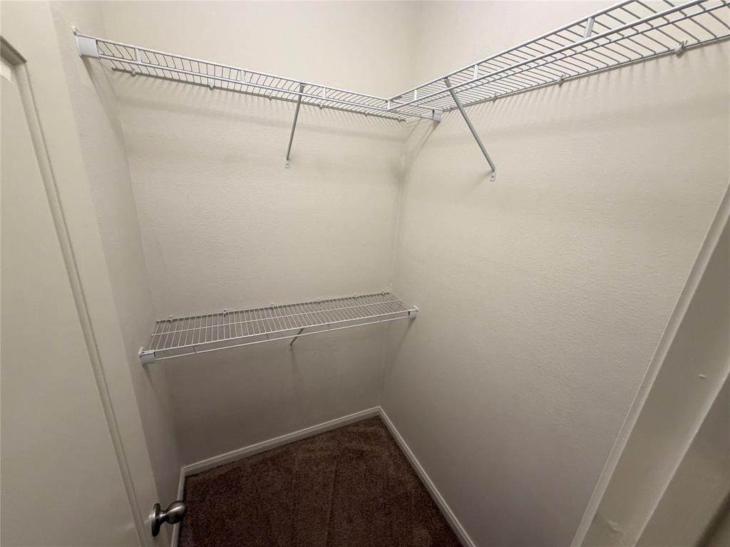 1601 Conley Lane Crowley, TX 76036 - Photo 11 of 17 a view of a room with racks on the wall