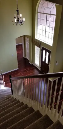 a view of entryway with wooden floor