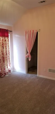 a view of empty room with windows