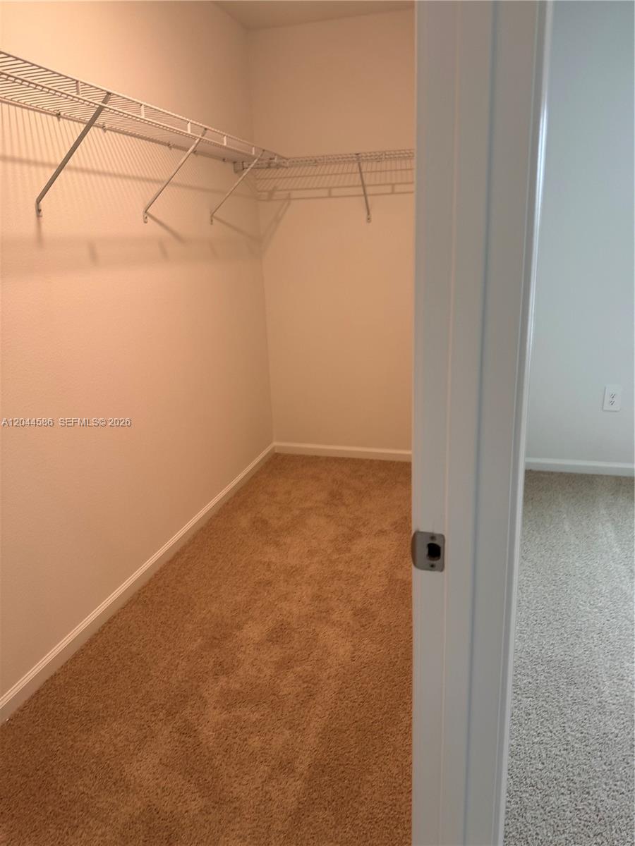 25 Redbud Road Palm Coast, FL 32137 - Photo 4 of 12 Primary Closet