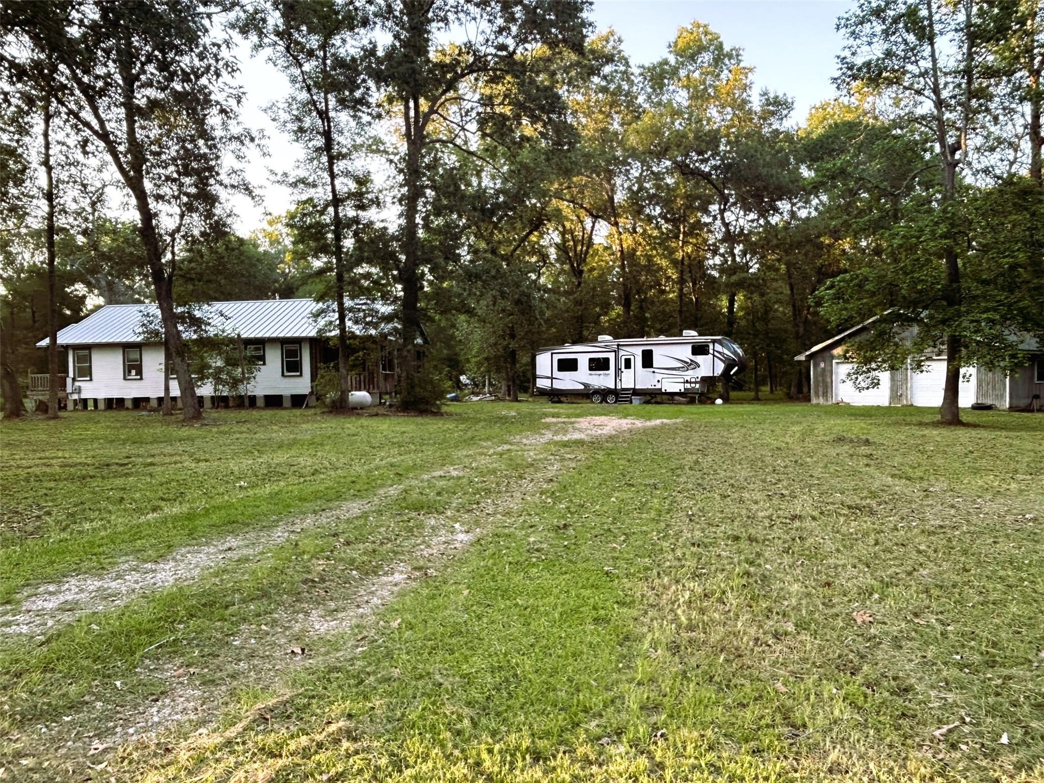 877 County Road 6474 Dayton, TX 77535 - Photo 11 of 27 a view of a house with a yard