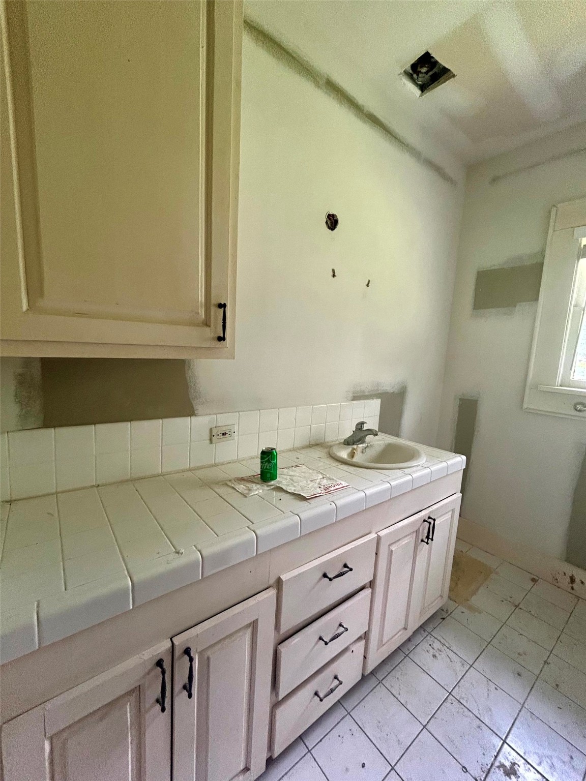 877 County Road 6474 Dayton, TX 77535 - Photo 23 of 27 a bathroom with a granite countertop sink and a mirror