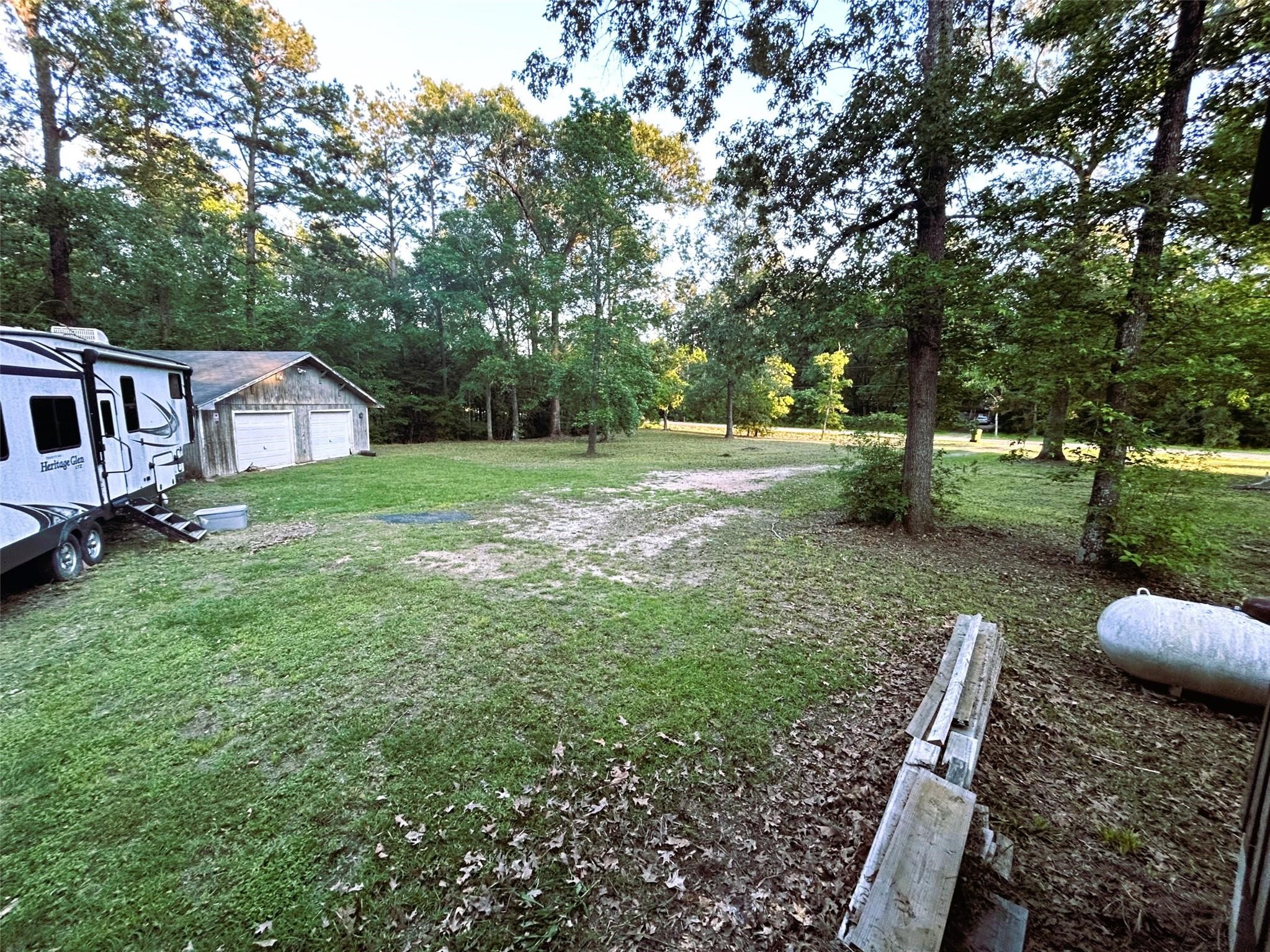 877 County Road 6474 Dayton, TX 77535 - Photo 8 of 27 a view of backyard of house with green space