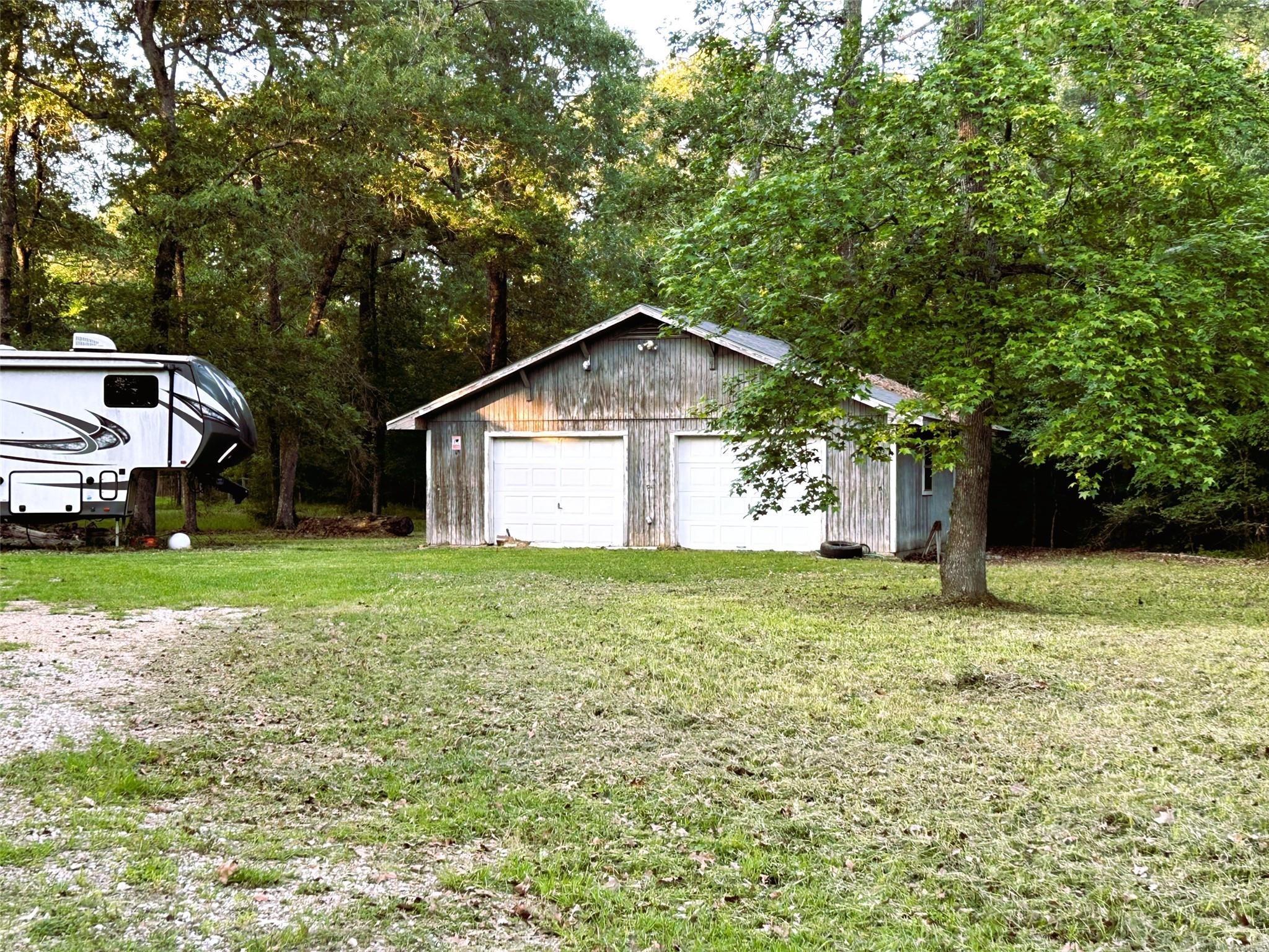 877 County Road 6474 Dayton, TX 77535 - Photo 9 of 27 a front view of a house with garden