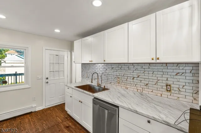 a kitchen with a sink and cabinets