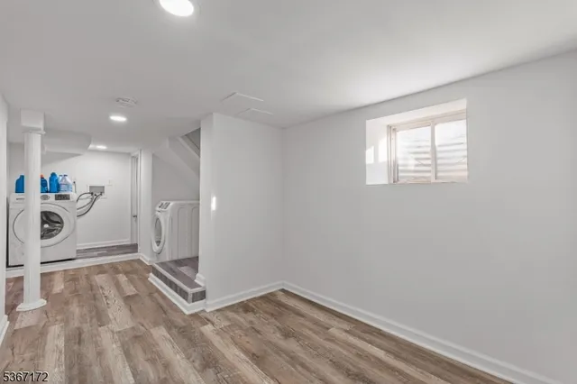 a view of an empty room and a window