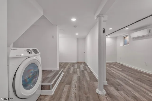 a view of a hallway with washer and dryer
