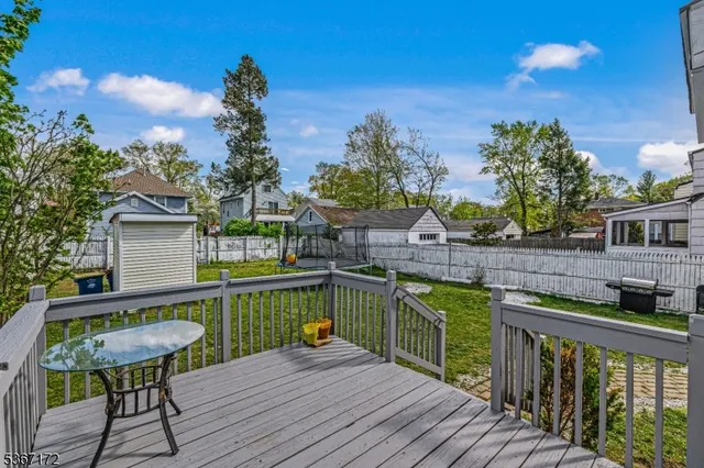a view of balcony with two chairs and wooden floor