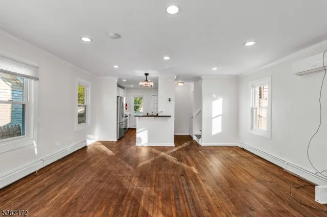 a view of kitchen with cabinets and wooden floor