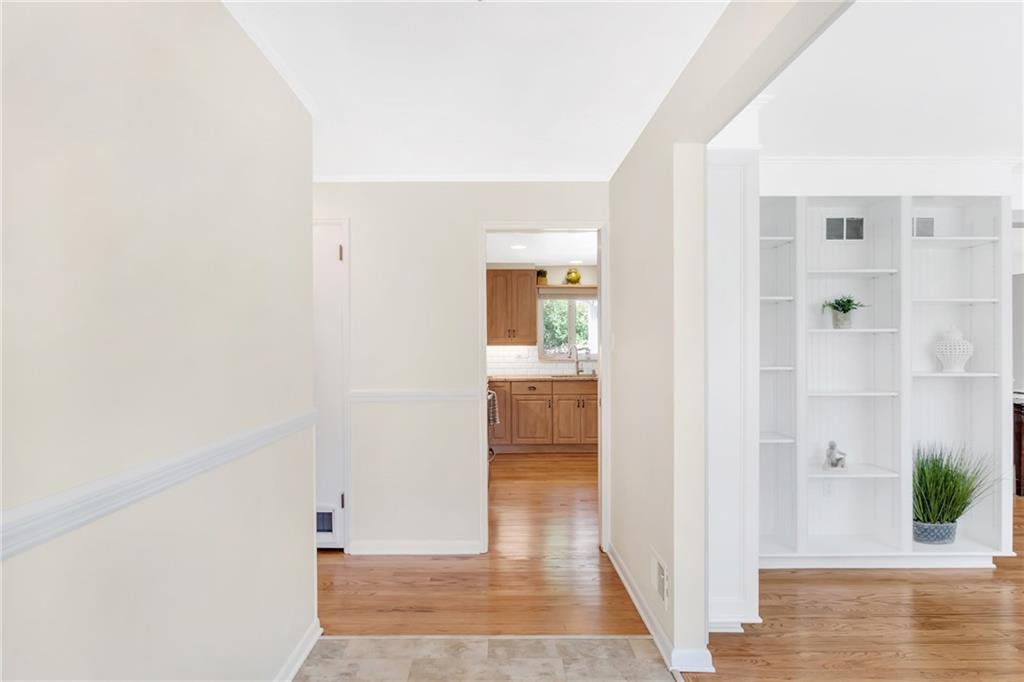 As you enter please note the new entry flooring.  To your right is the living room, ahead is the kitchen and to the left are the bedrooms, bathrooms and the doorway to the basement.