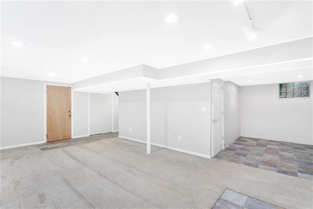 69 Holland Road Pittsburgh, PA 15235 - Photo 22 of 25 To the right is a 14x8 space that can be utilized as an office, gym, or play area
