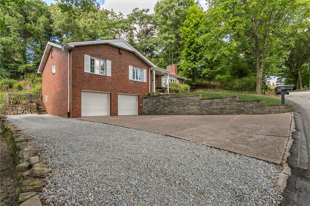 69 Holland Road Pittsburgh, PA 15235 - Photo 25 of 25 The large two car garage has ample space for a work area and storage. The side has of the driveways has had gravel applied to allow for extra parking for family and /or friend gatherings. Come and make it your own!