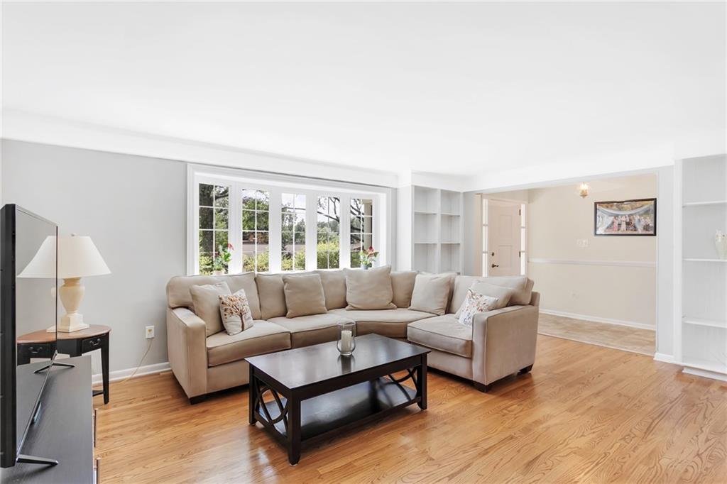 This photo is taken from the dining room looking into the living room and the entry.  There is plenty of space for large furnishings.