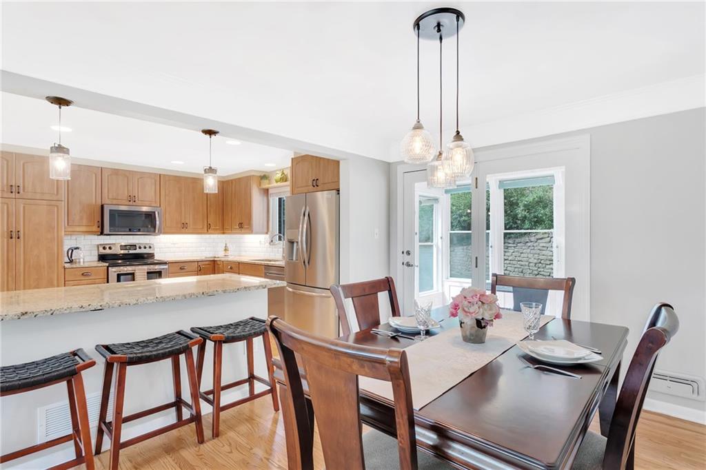 69 Holland Road Pittsburgh, PA 15235 - Photo 9 of 25 With the removal of the kitchen wall it has expanded the counter space and proved an area for sitting to eat breakfast or extra area for guests/family to sit and visit. There is new lighting above that area.