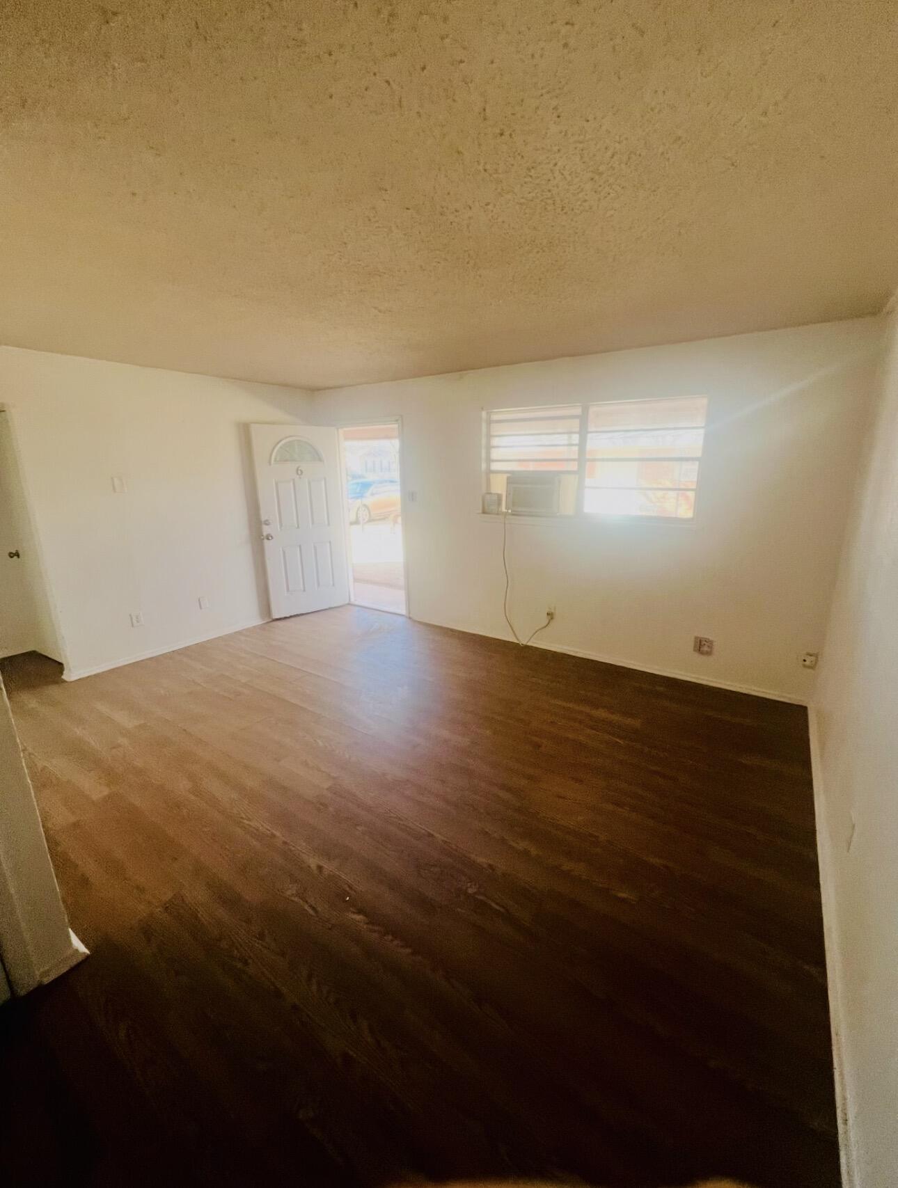 1510 29th Place Lubbock, TX 79411 - Photo 7 of 9 a view of empty room with wooden floor