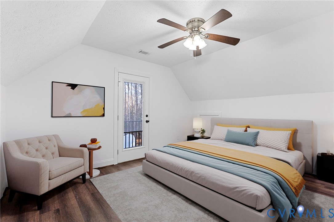 6329 Orchard Road New Kent, VA 23124 - Photo 21 of 25 a bedroom with a large bed couch and a window