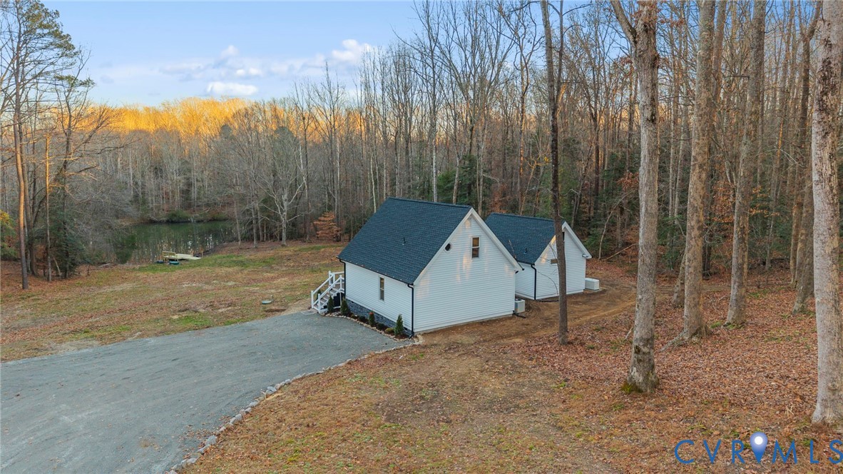 6329 Orchard Road New Kent, VA 23124 - Photo 23 of 25 a house with trees in front of it
